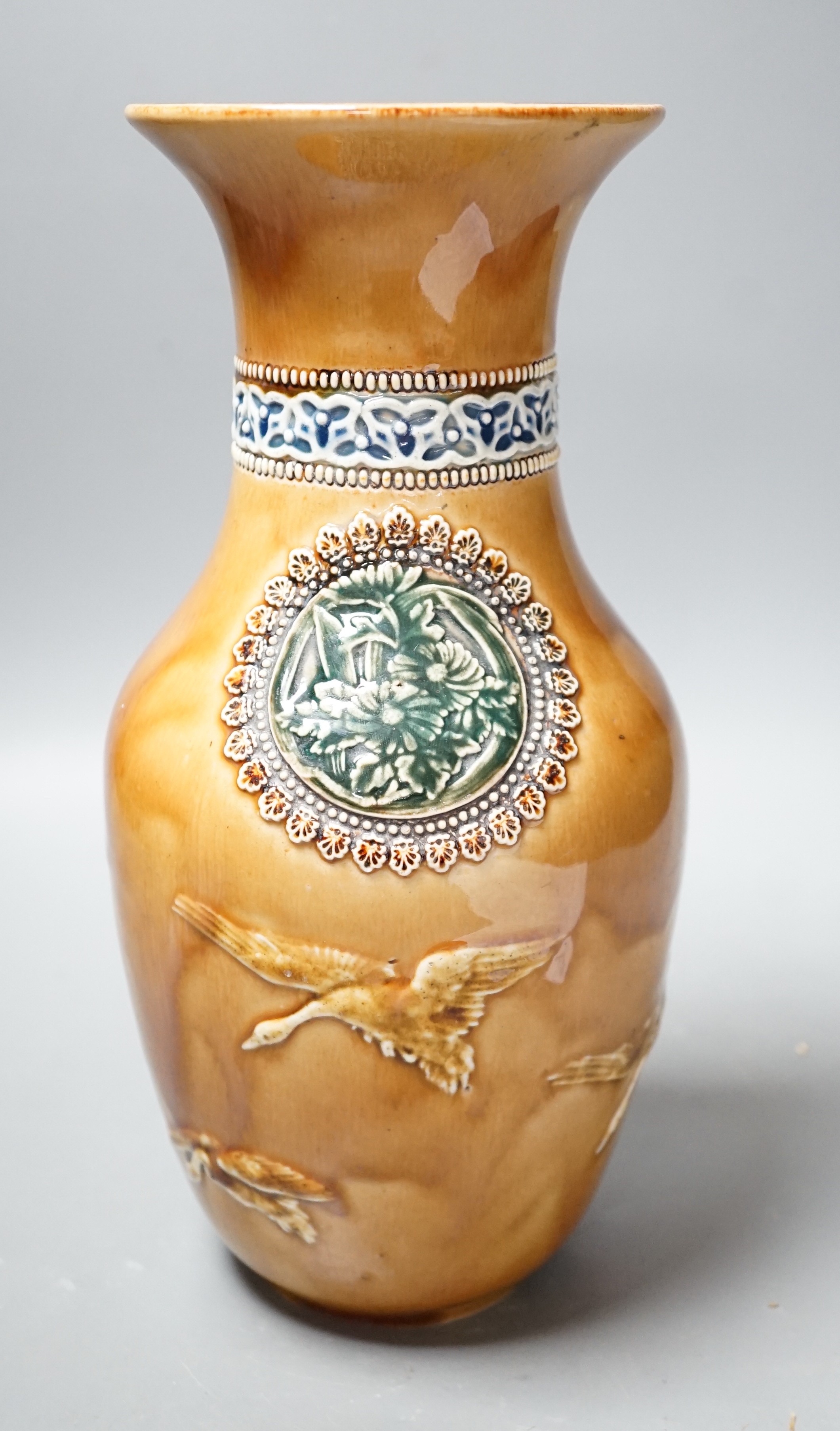 A Doulton Lambeth Aesthetic period stoneware vase, c.1885, decorated with Japanese cartouches and cranes in-flight, 27.5cms high